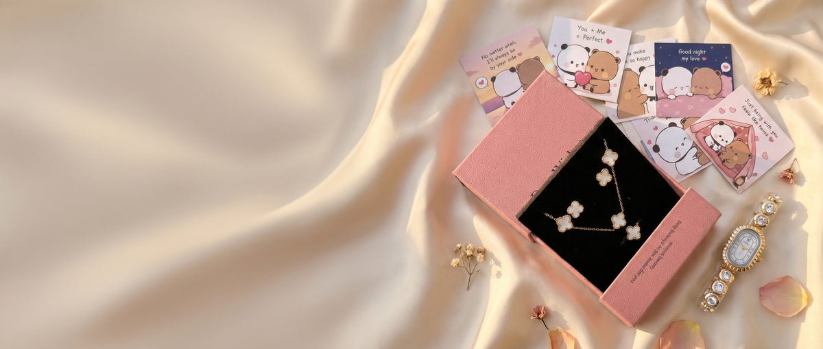 Clover jewellery set and gold watch on champagne silk