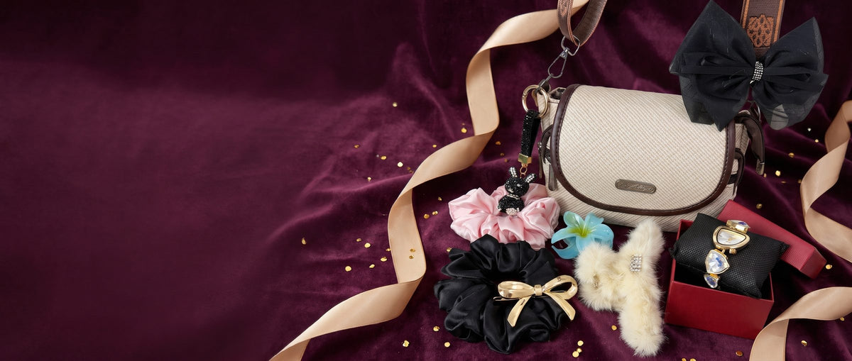 Premium gift hamper with handbag on plum velvet with gold ribbon